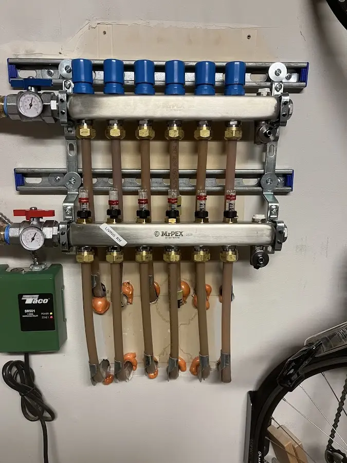 Plumber performing Water Heater Repair at a residential property in New River